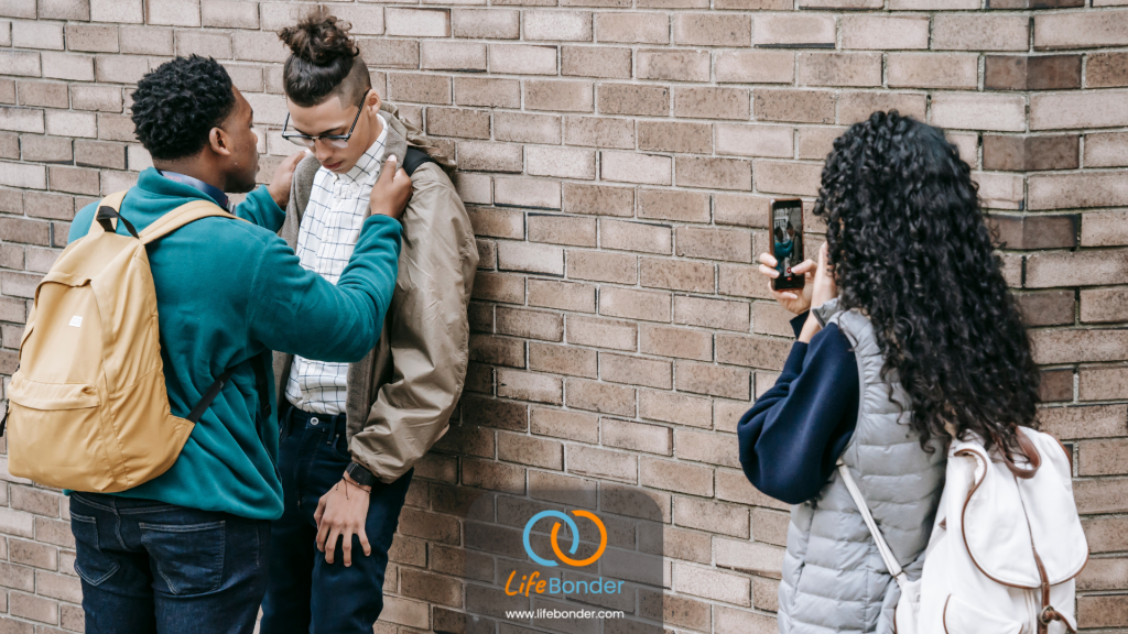 Causes of Social Anxiety:
A boy being bullied by one boy and a girl.