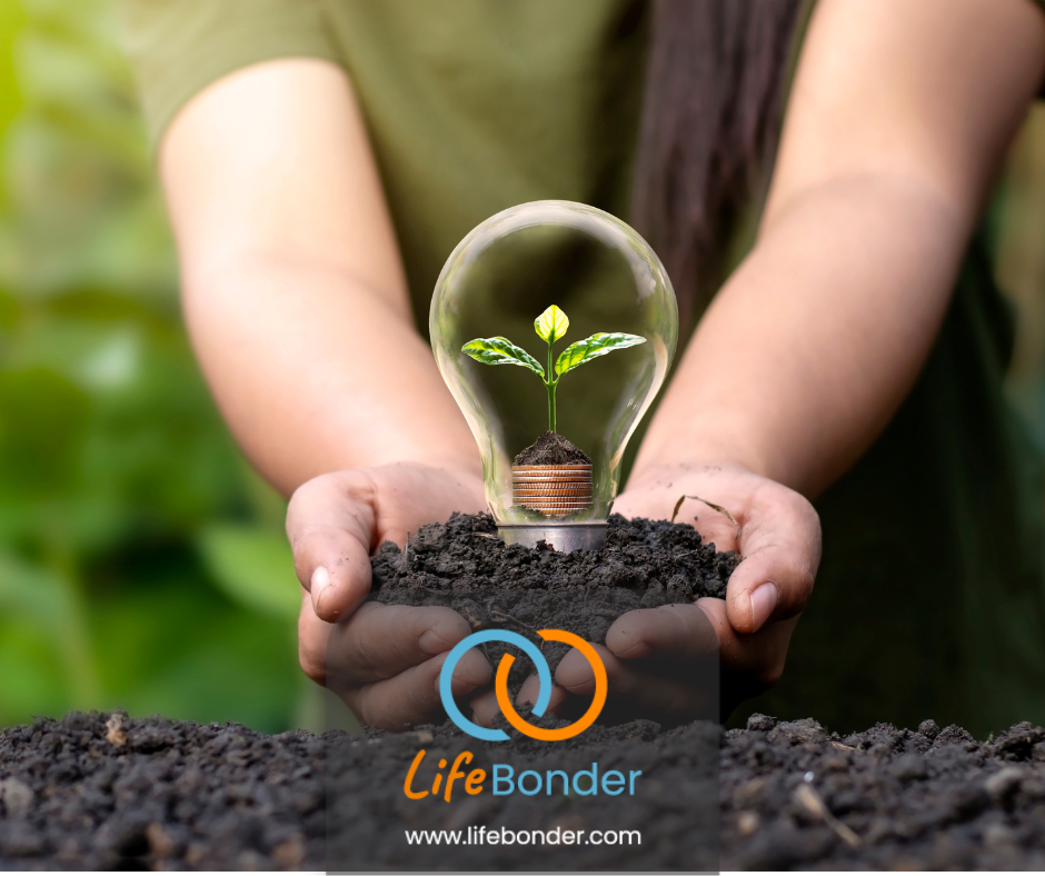 Sustainable travel is represented by two hands holding a bulb with a growing sapling. It represents how we need to protect our nature