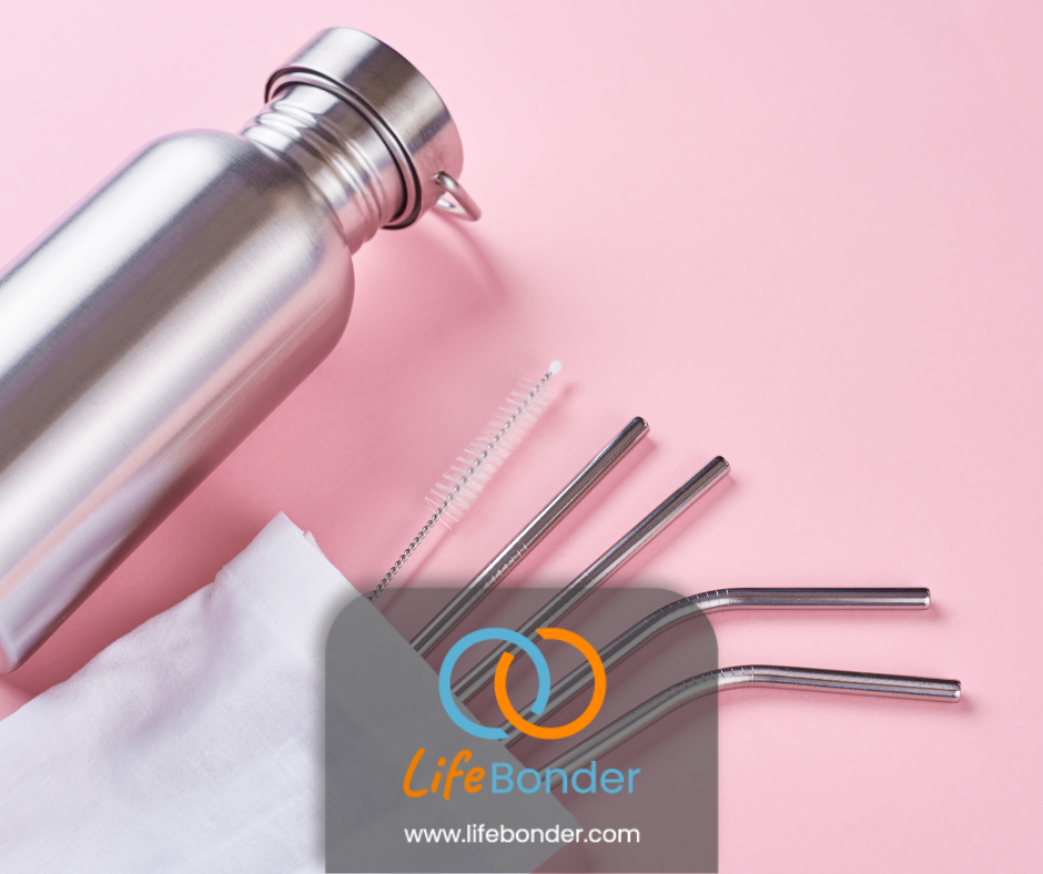 Image of reusable water bottle, steel straws on a pink background. The logo of LifeBonder at the bottom.